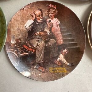 This is a Norman Rockwell limited edition collector plate titled "The Cobbler